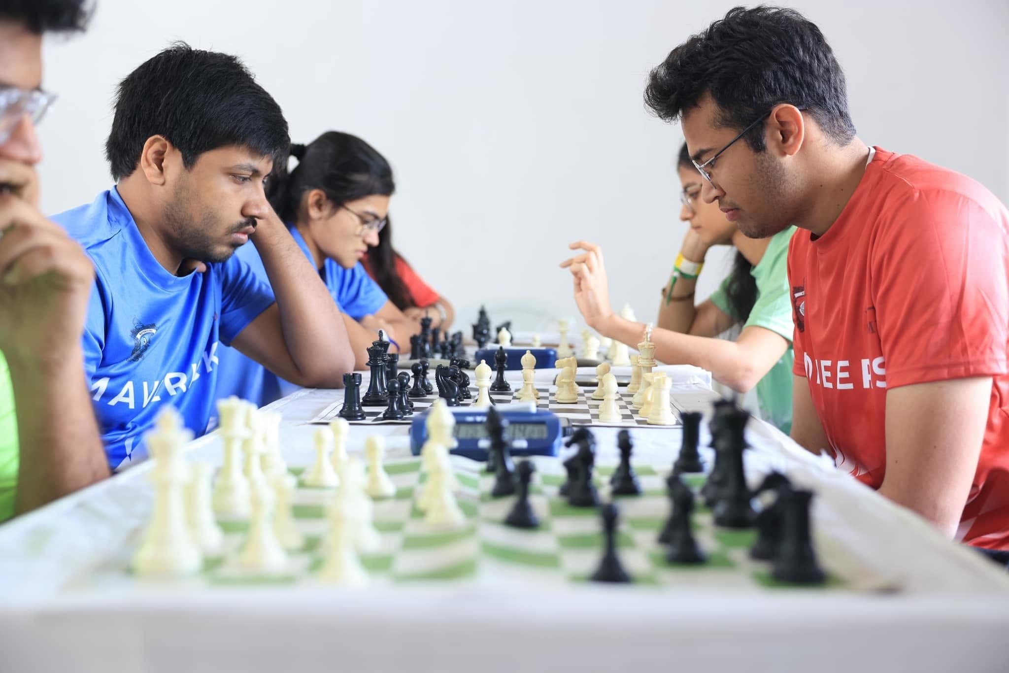 Participants concentrate on a chess match during the 2024 festival