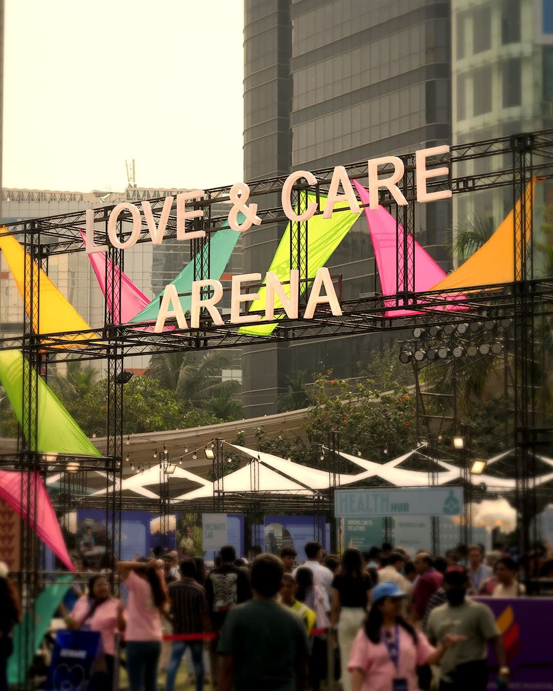 Festival visitors beneath the Love and Care Arena entrance